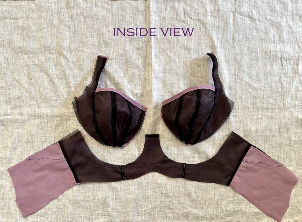 Inside view of deconstructed purple bra with black lining