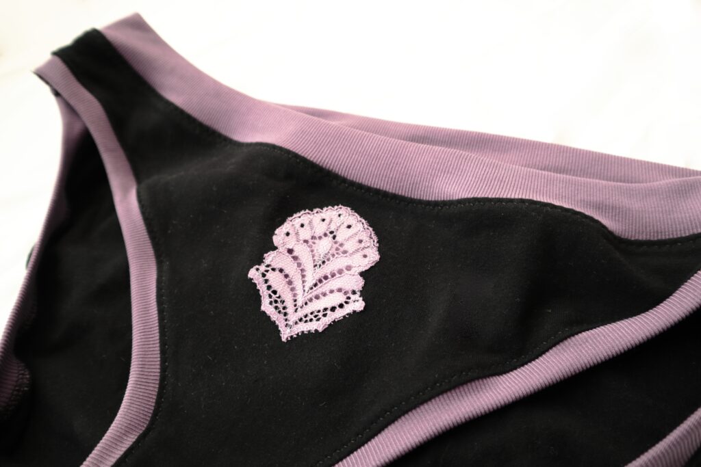 Black underwear with purple lace accents