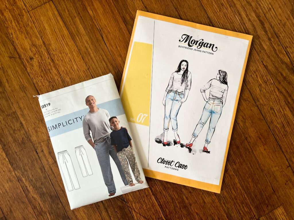 Two sewing pattern envelopes. One is Simplicity 8519, the other is Closet Core Patterns Morgan Jeans